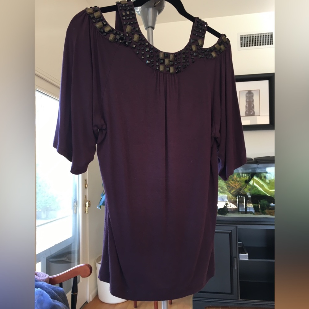 Purple blouse with shoulder cut outs and gemstone accents